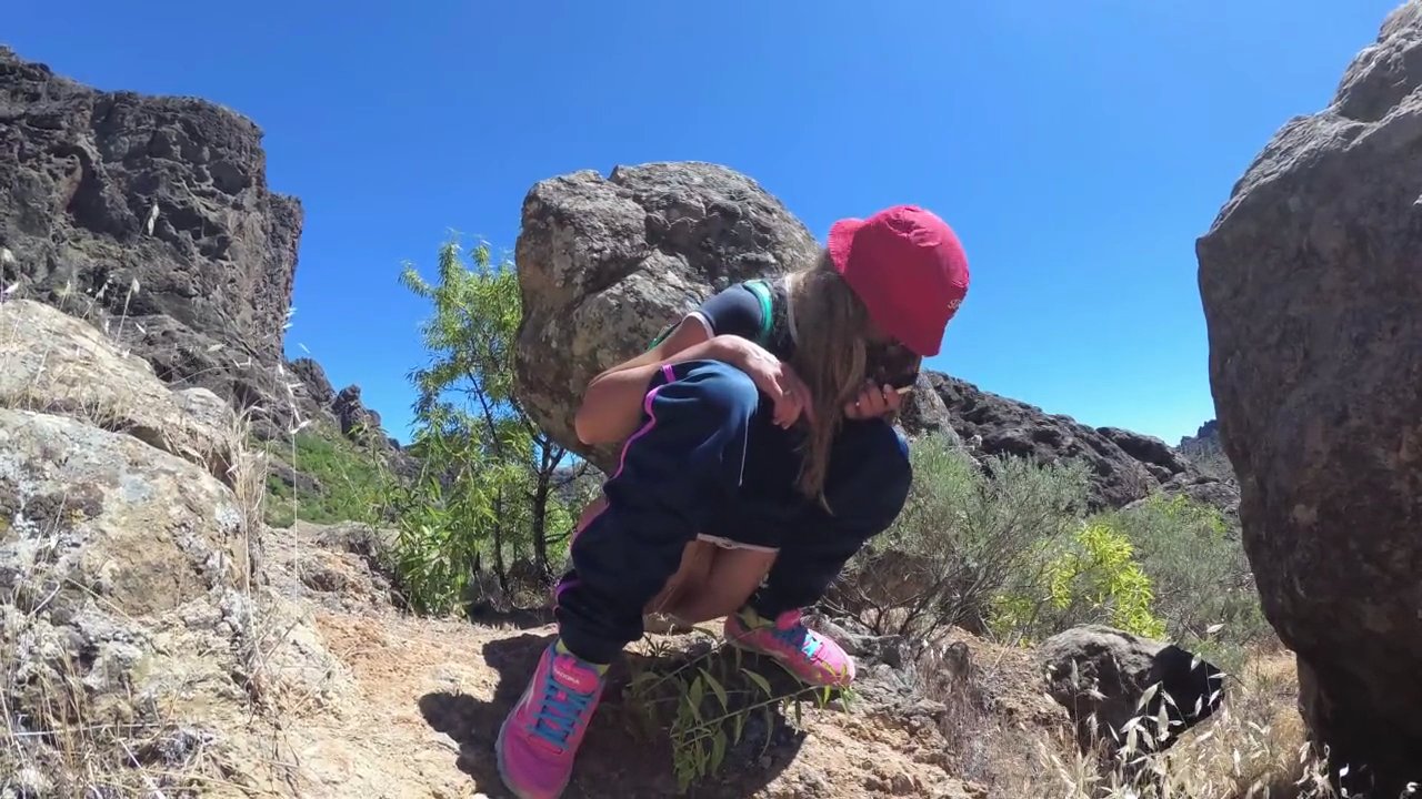PISS PISS TRAVEL - Young girl tourist peeing in the mountains Gran Canaria_cover.jpg